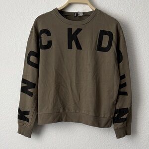 Divided Olive Crewneck Sweater with Black Lettering ‘KNOCKDOWN’